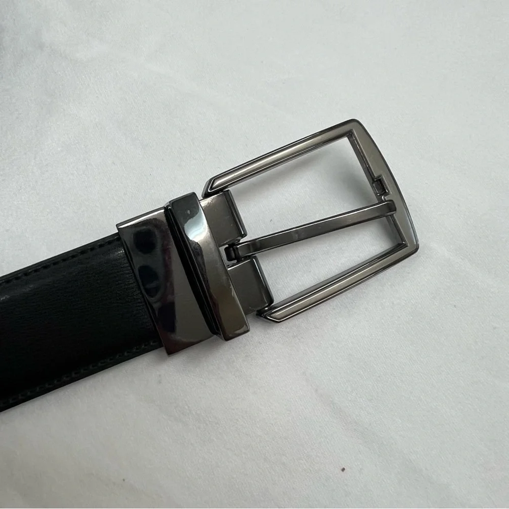 Men’s black and dark brown reversible genuine leather belt.